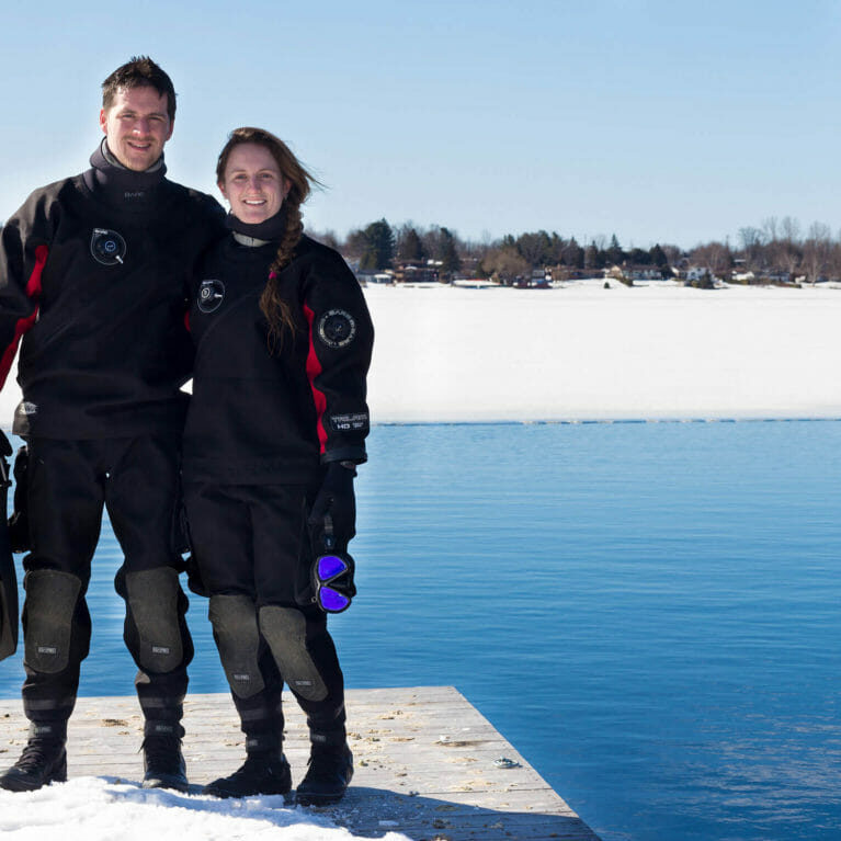 In this image: Joey and Ali Posta pose before a dive.