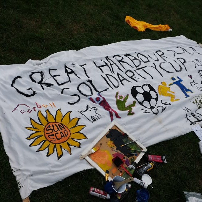 A banner for the Great Harbour Solidarity Cup, with the logos of the organizations that supported the event, the Student Union of NSCAD, Workers Alliance, King's Student Union and Nova Scotia Student Strike. (Dylan Follett/The Dalhousie Gazette)