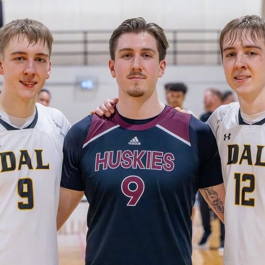 Caleb [left], Micah [centre], and Riley Stewart pose for a photo after Saint Mary’s University played Dalhousie University’s men’s basketball team at the Dalplex in Halifax, NS. 
