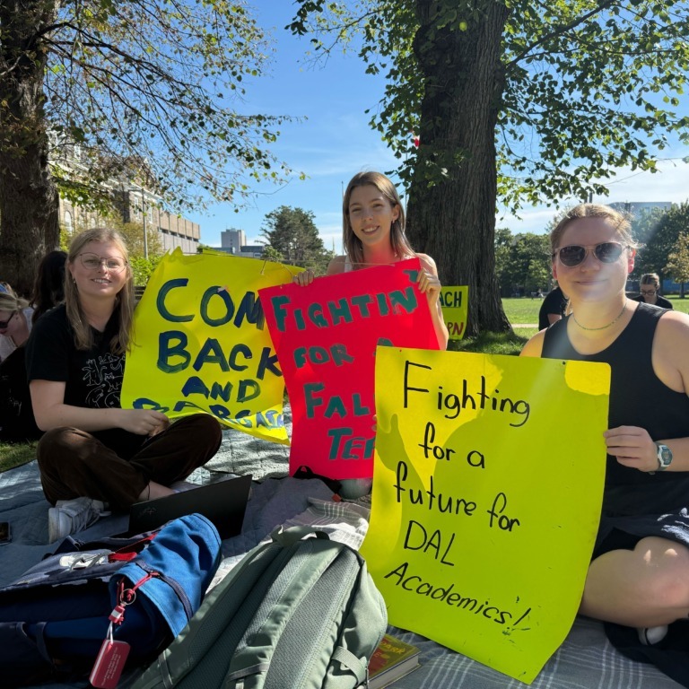Students sit in front of the Henry Hicks Administration Building at Dalhousie University in Halifax, N.S. on Sept. 9, 2025. (Jonas May/The Dalhousie Gazette)