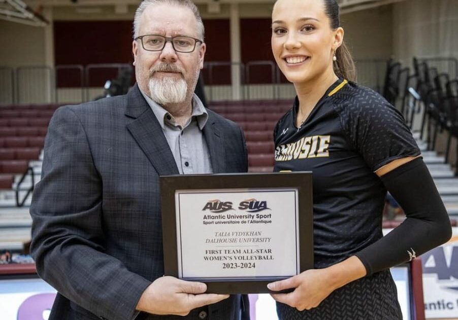 Vydykhan being awarded her plaque for being named an AUS first-team all-star. Image credit: Dal women’s volleyball on Instagram