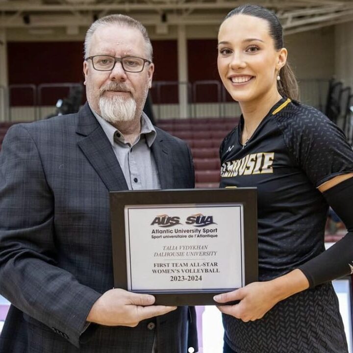Vydykhan being awarded her plaque for being named an AUS first-team all-star. Image credit: Dal women’s volleyball on Instagram