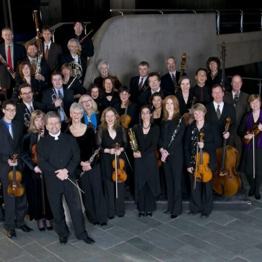 The smiling Symphony Nova Scotia. Photo courtesy www.symphonynovascotia.ca. Photo by Aaron McKenzie Fraser, www.amfraser.com.