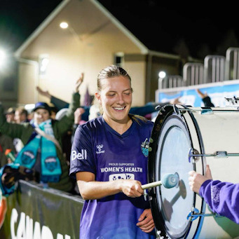 Saorla Miller bangs a celebratory drum at the Wanderers Grounds in Halifax, Nova Scotia, on Oct. 2, 2025. Miller scored two goals in a Northern Super League game between the Halifax Tides and Montreal Roses. (Halifax Tides Media)