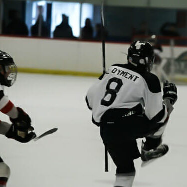 In this image: Luke Dyment pictured playing hockey.