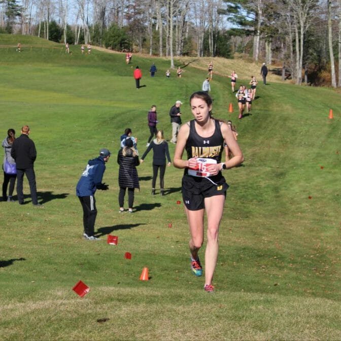In this image: Jessica Needham running during an AUS championship meet.
