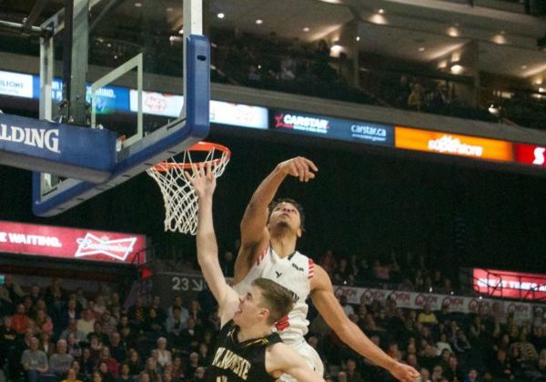 Veinot blocked shot In this image: Keevan Veinot's shot is blocked by Eddie Ekiyor.
