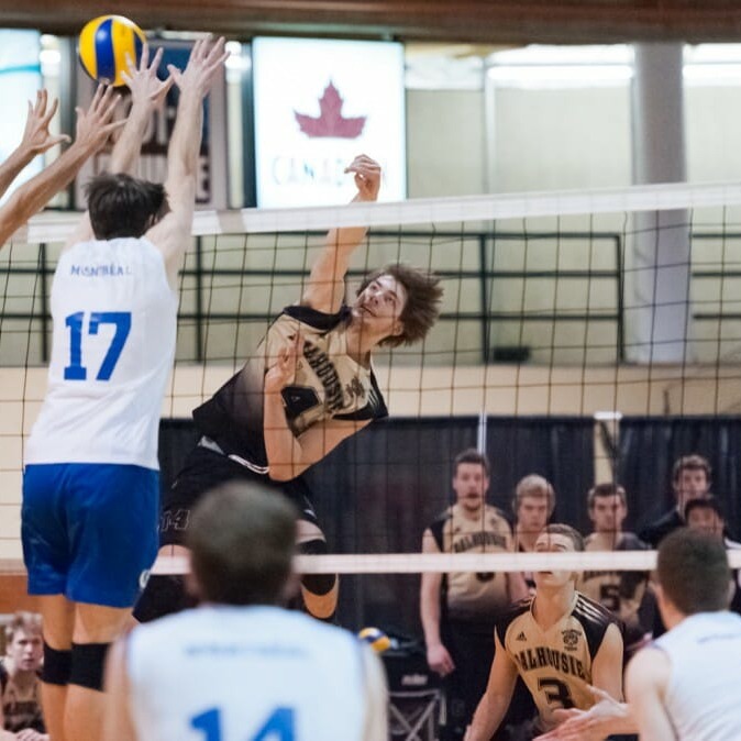 Kristen O'Brien tries to break the Montreal block in the Tigers' five-set victory over the Carabins. (Chris Parent photo)