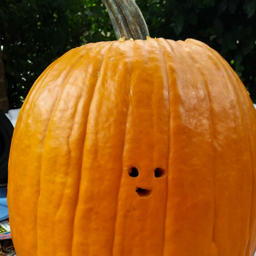 In this image: A carved pumpkin.