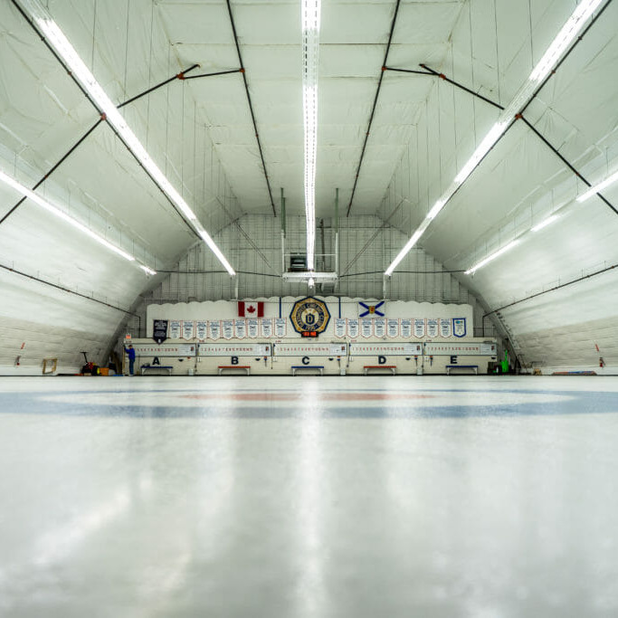 In this image: an ice rink for curling.