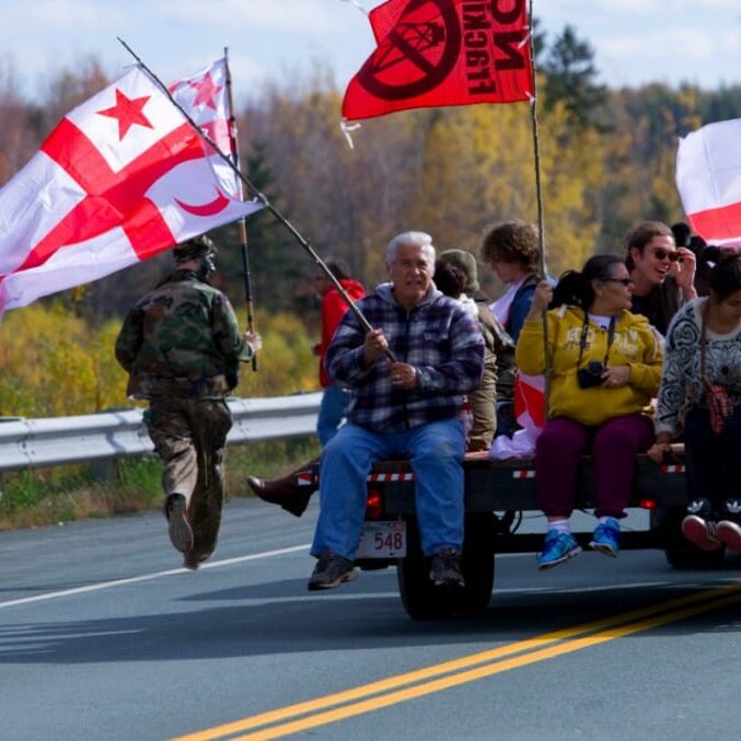 frack Supporters drive down Highway 11 between the barricades near Rexton, NB (photo by Bryn Karcha)
