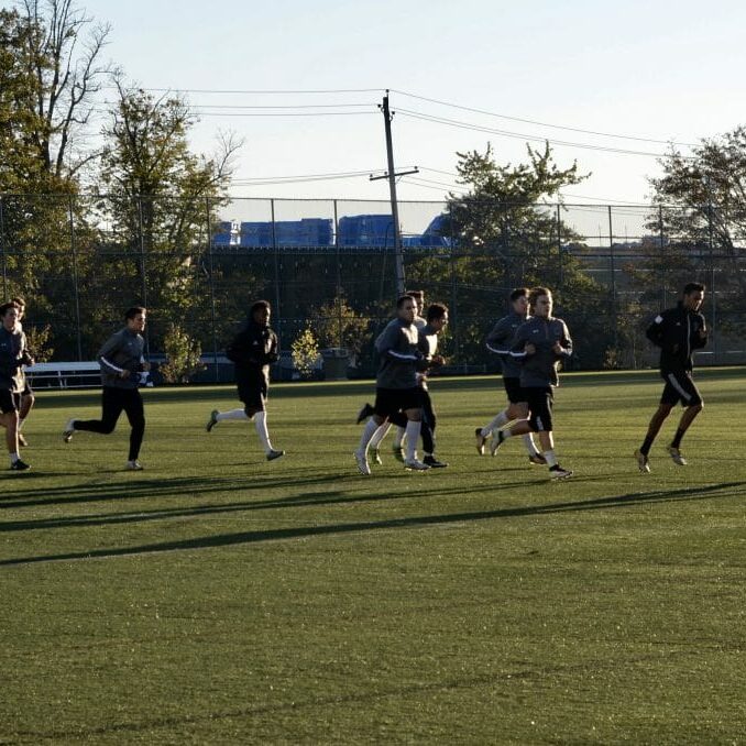 Warming up for the big weekend: the men's soccer team prepares for practice at the Wickwire Field. 