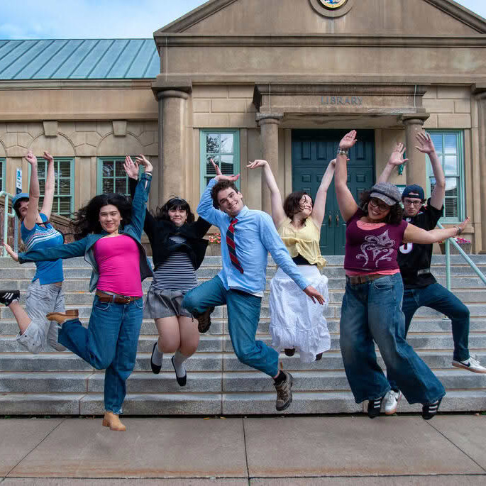 Students pose for a Glee-inspired photo shoot outside the University of King's College Library on Sept. 30, 2026 in Halifax N.S. (Zoey Beardshaw/The Dalhousie Gazette)