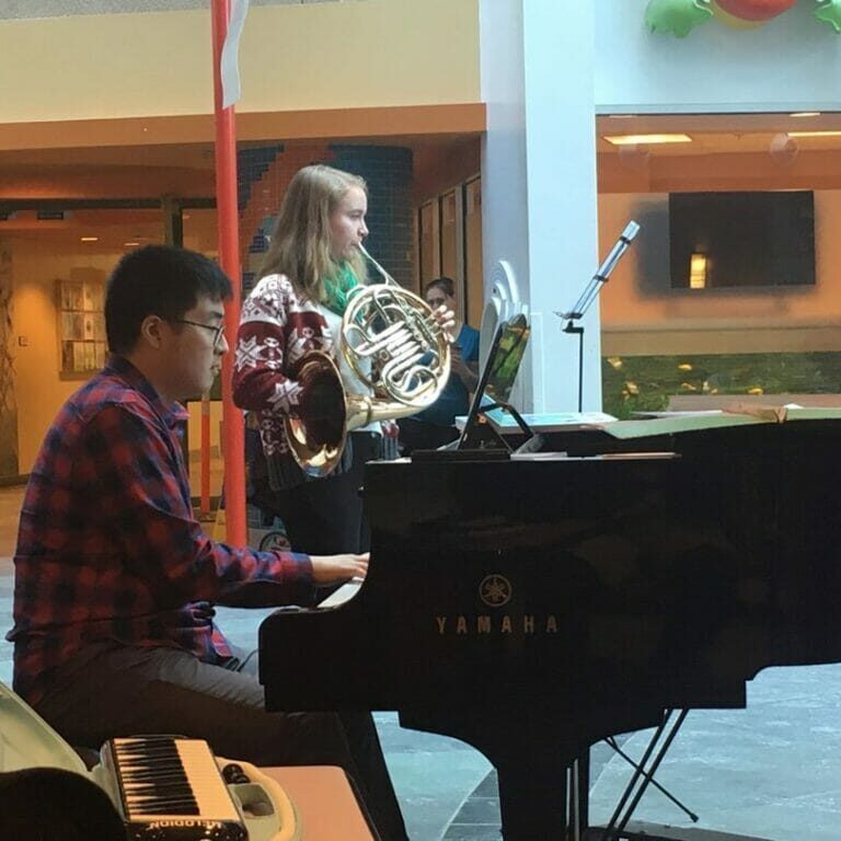 The Music and Healing Society's Christmas Concert at the IWK in December 2019. Pictured left to right are Andrew Son, Caitie Ahern. (Photo provided by Andrew Son) 