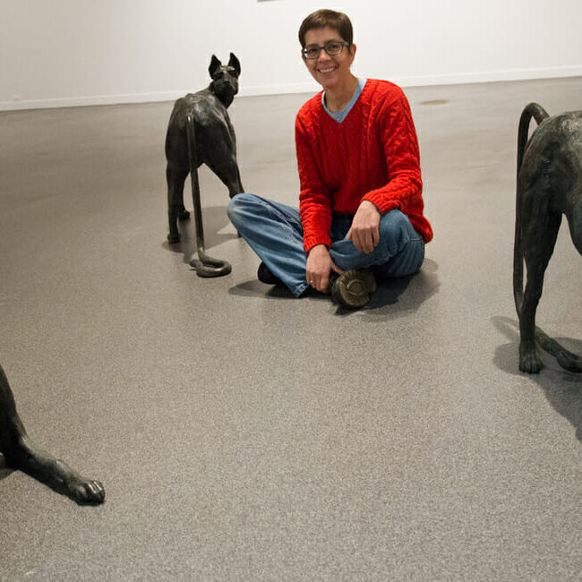 Gallery proprietor Michele Gallant poses with the latest exhibit.