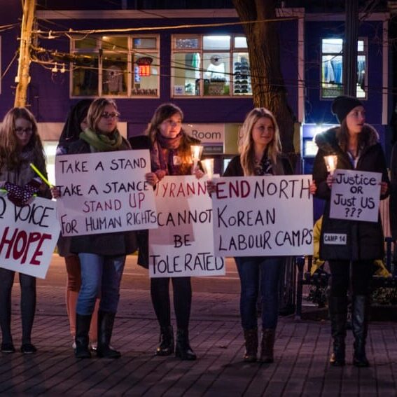 The ‘Parade of Rights’ stopped in Victoria Park before heading to the Security Forum.