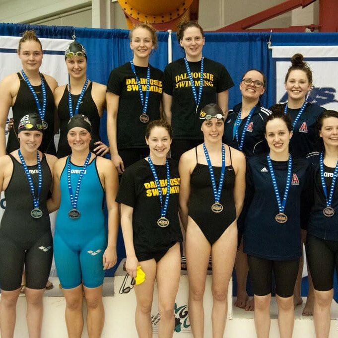 Dal won gold in the 4x100 metre freestyle relay. Middle four, clockwise from top left, Mary Claire Lynch, Michelle Campbell, Ceilidh MacPherson, Molly Wedge. (Photo by Shelley Ebbett via UPEI Athletics)