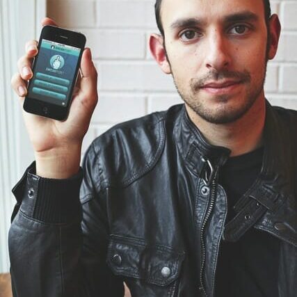 App creator Lee Gancman holds up his masterpiece. Photo by Sam Grant
