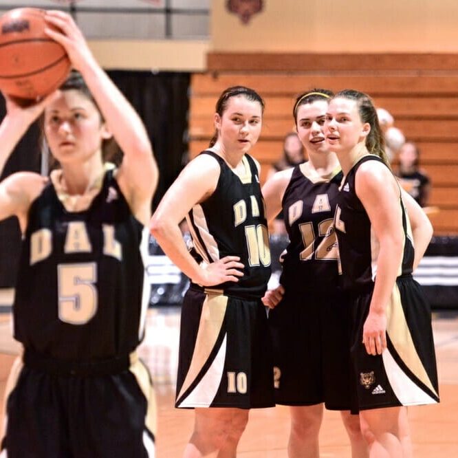 Tessa Stammberger (10) confers with her Tigers teammates. (Photo by Kit Moran)